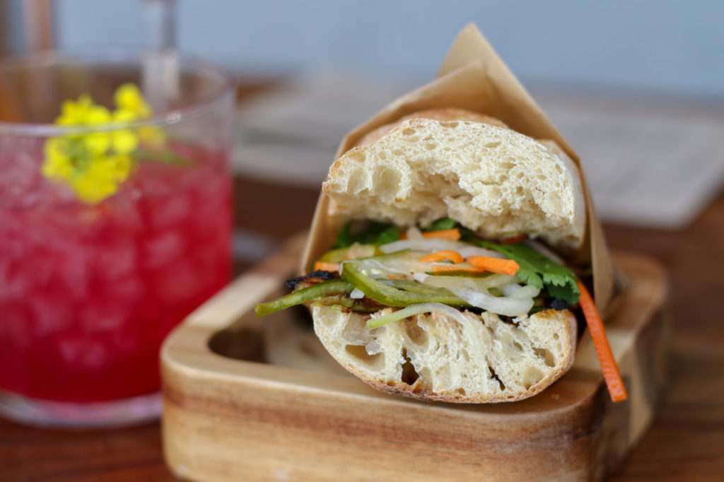 BBQ Pork Banh Mi with pickled carrot, daikon, cilantro, pate, cucumber, jalapeno, mayo at Duke’s Common in Healdsburg. (Photo by Heather Irwin)