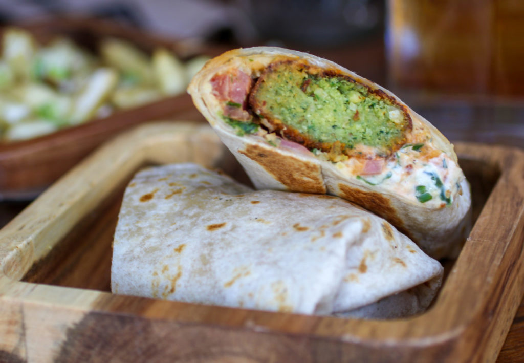 Falafel-ritto with hummus, tzatziki, tabbouleh, pickled onion at Duke’s Common in Healdsburg. (Photo by Heather Irwin)