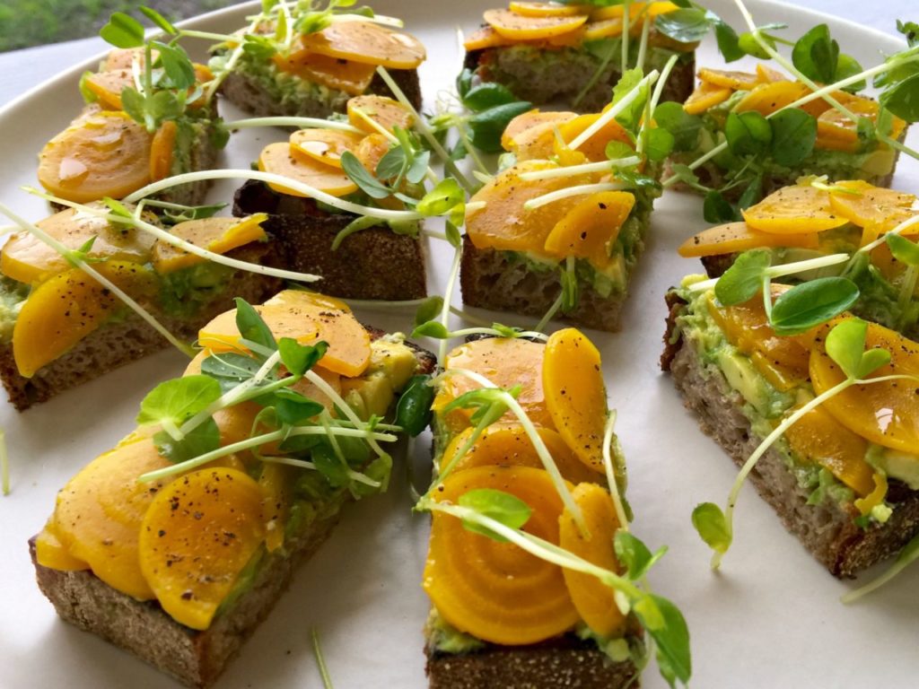 Sliced beets, avocado and pea shoots on rEvolution Bread at The Pharmacy Cafe in Santa Rosa (Heather Irwin/The Press Democrat)