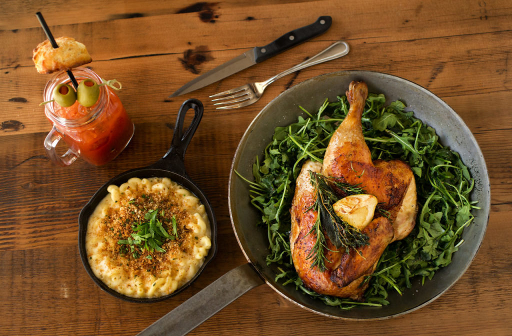 "Spatchcocked" Roasted Chicken with a side of Petaluma Creamery White Cheddar Mac N' Cheese and a Must Be Your Mama's Car cocktail with Green Mark vodka, house-made Bloody Mary mix topped with a homestyle biscuit from Chicken Pharm, a Public House in Petaluma. (photo by John Burgess/The Press Democrat)