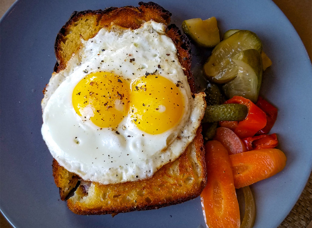Bocadillo with smoked ham, pimenton, bechamel, manchego cheese and fig jam with a double-yolked egg at Pearl restaurant in Petaluma. heather irwin/PD