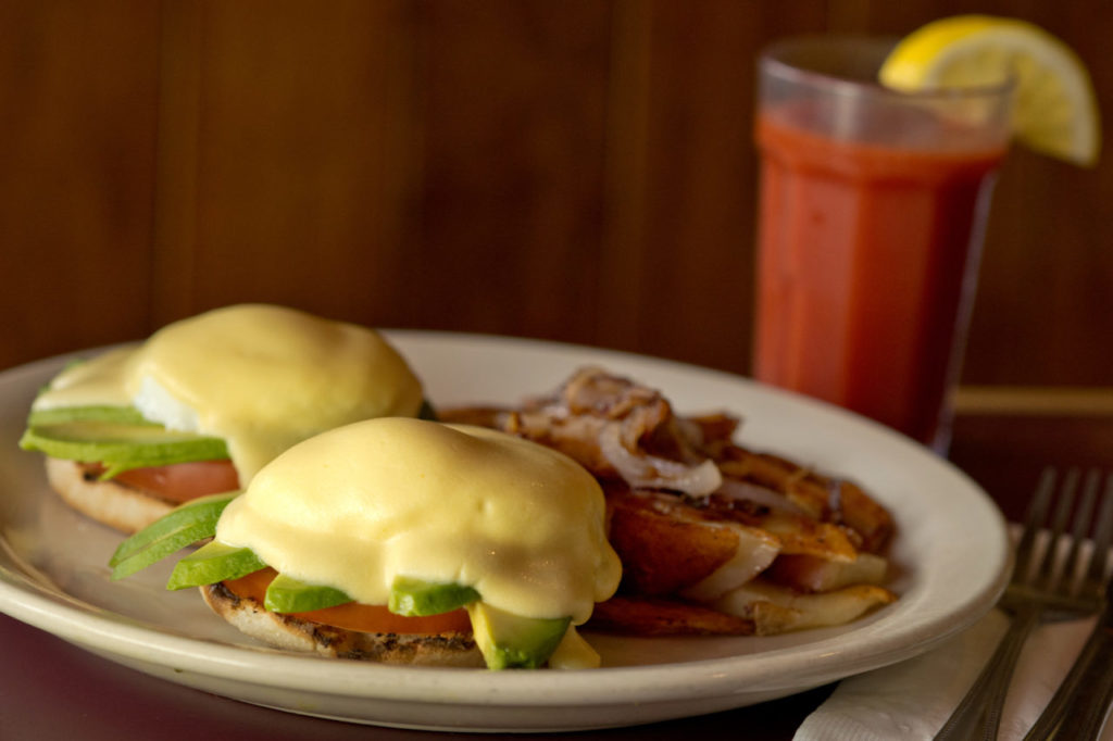 The California Benedict, two poached eggs, avocado, tomato and Hollandaise sauce on an English muffin, served with cottage fries, at Hank's Creekside Cafe in Santa Rosa, California, on August 20, 2014. (Alvin Jornada / For The Press Democrat)