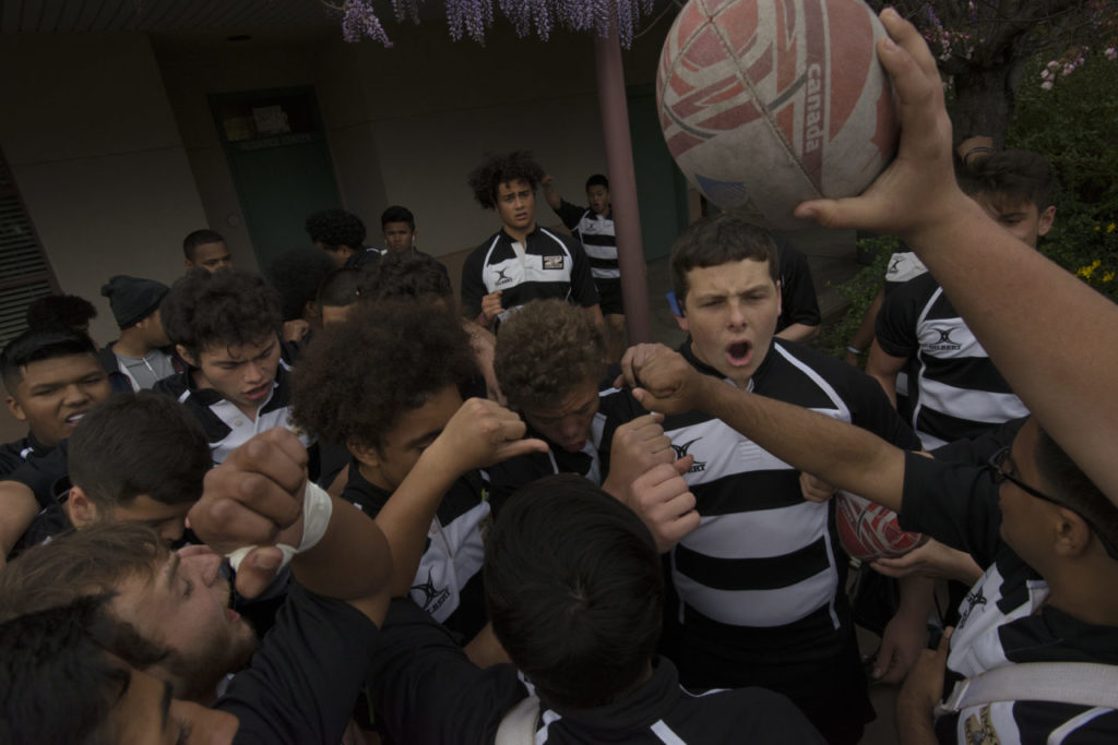 The Lobo Rugby Club doing their Lobo cheer before a game against Santa Rosa High held at Elsie Allen Friday evening. March 25, 2017. (Photo: Erik Castro/for The Press Democrat)