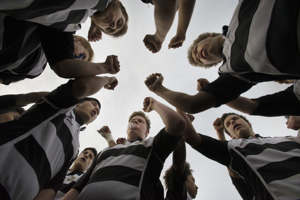 The Lobo Rugby Club doing their Lobo cheer before a game against Santa Rosa High held at Elsie Allen Friday evening. March 25, 2017. (Photo: Erik Castro/for The Press Democrat)