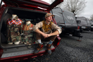 Textile artist Luke Fraser lives temporarily in a FEMA supplied trailer near the Sonoma County Fairgrounds in Santa Rosa. Fraser, who saw his Glen Ellen workshop go up in flames, has designed a line of urban wear incorporating local sports teams. (Photo by John Burgess/The Press Democrat)