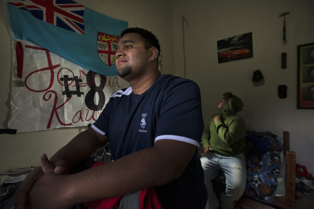 Joshua Kauvesi, left, a Maria Carrillo Senior in his bedroom with fellow Lobo Rugby Club player and Montgomery High School freshman Rashawn Miles, 15. The two live practically next door to each other in the same apartment complex in Santa Rosa.They hang out often, swim in the apartment's pool and in the Summer sometime play rugby together in a grassy area in the center of the apartment complex. April 19, 2017. (Photo: Erik Castro/for The Press Democrat)