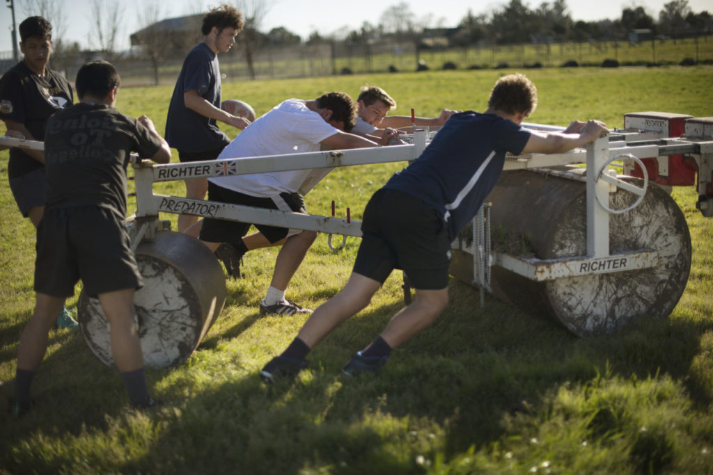 Players wheel out the scrum machine onto the field during Lobo Rugby Club practice at Elsie Allen High School in Santa Rosa, California. March 2, 2017. (Photo: Erik Castro/for The Press Democrat)