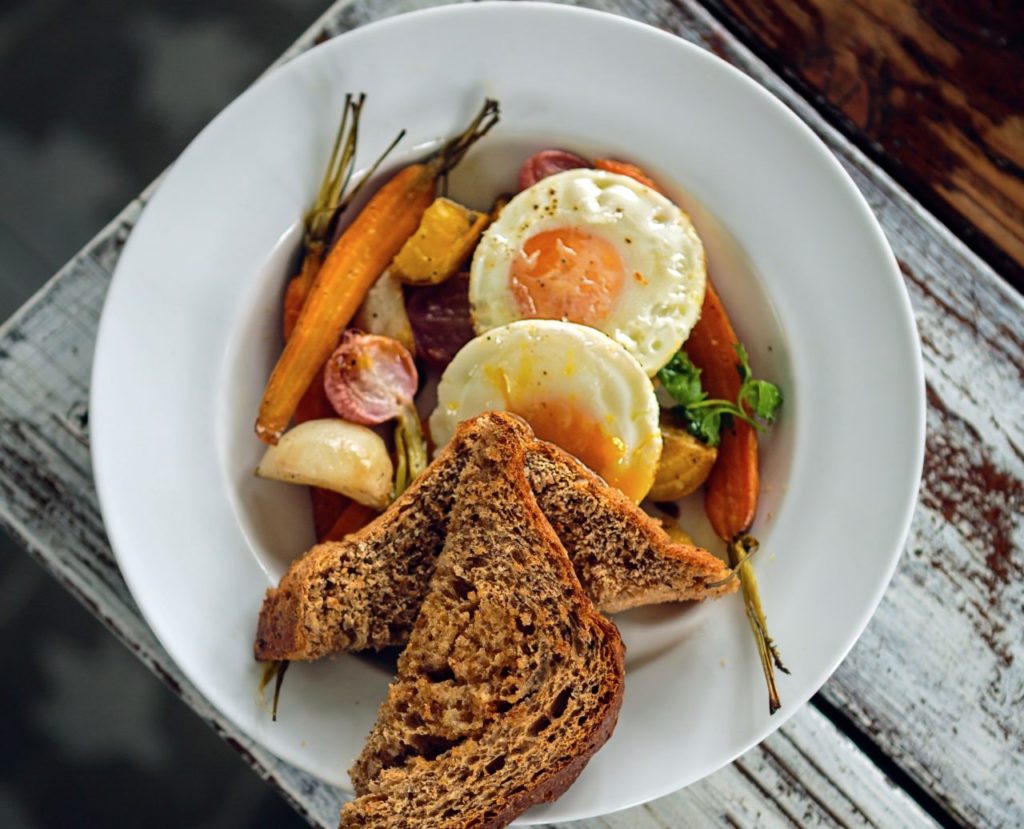 Naked Pig restaurant for story on breakfasts and owners Jason Sakach and Dalia Martinez The Roots breakfast with eggs, roasted fall veggies and cracked whole wheat toast