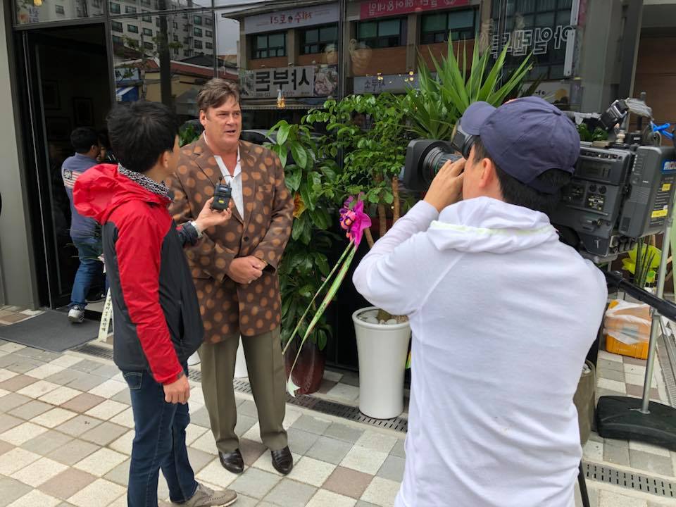 Taylor being interviewed by news crews at opening of Don Taylor Omelette Express in JeJu City on JeJu island in southern Korea. Santa Rosa restaurateur Don Taylor was on hand for the opening. Courtesy: Facebook