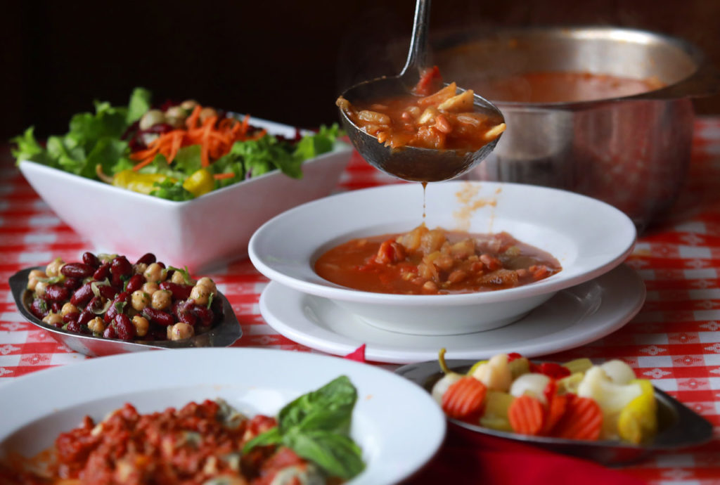 The full dinner pasta dinner includes minestrone, a mixed green salad, antipasto, salami and French bread from Negri's Italian Dinners and Joe's Bar in Occidental. (John Burgess/The Press Democrat)