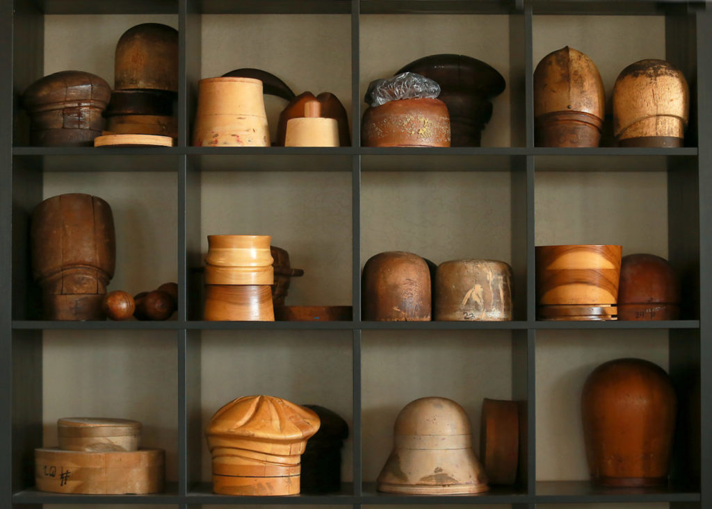 Old-fashioned wooden hat forms decorate The Hattery in Santa Rosa. (photo by John Burgess/The Press Democrat)