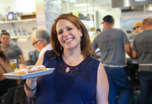 Owner Susie Pryfogle with beignets at Tips Roadside in Kenwood. Heather Irwin/PD