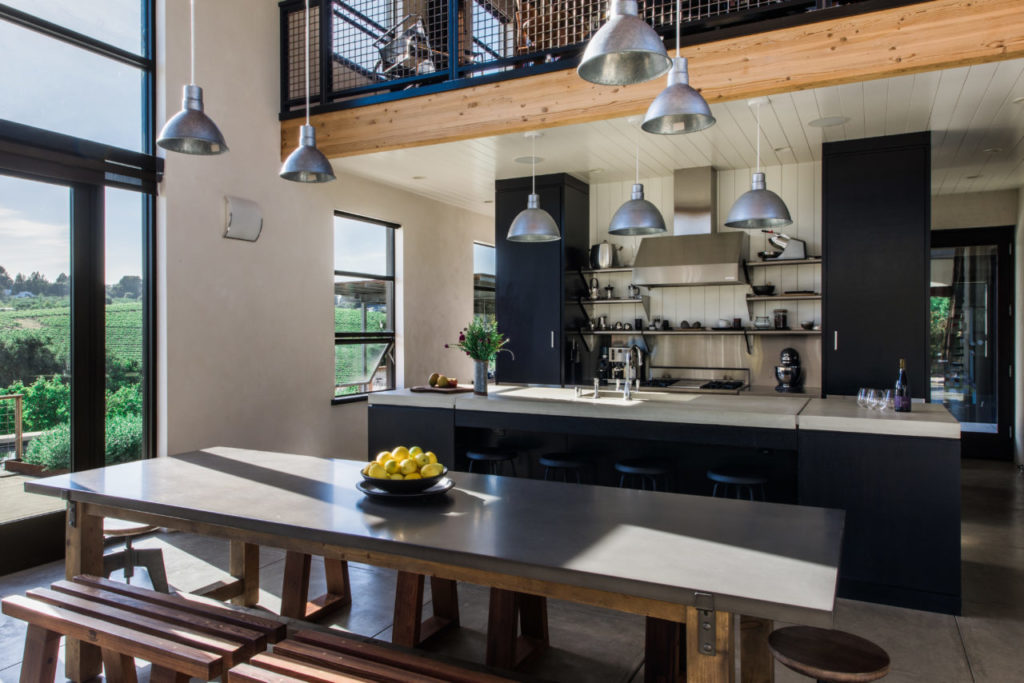Restoration Hardware dining table with custom redwood benches created by Jesse Almos of Sonoma Woodworks.