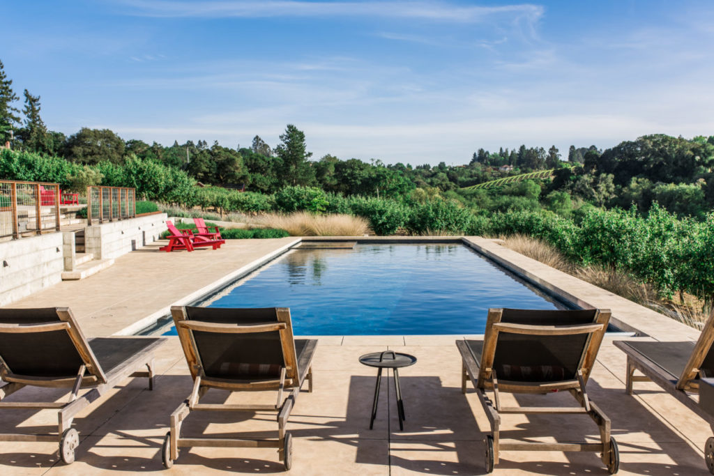 The family enjoys spending much of their time in the outdoor living space designed and executed by landscape architects Merge Studio Inc.
