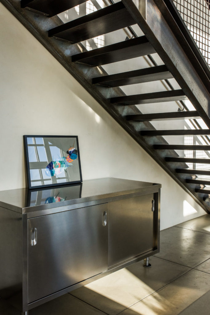 Quovis Stainless Steel Credenza adorned with Claire's artwork.