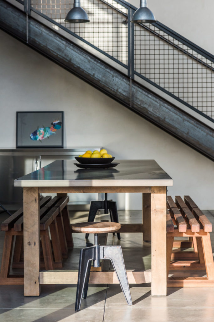 Restoration Hardware dining table with custom redwood benches created by Jesse Almos of Sonoma Woodworks.