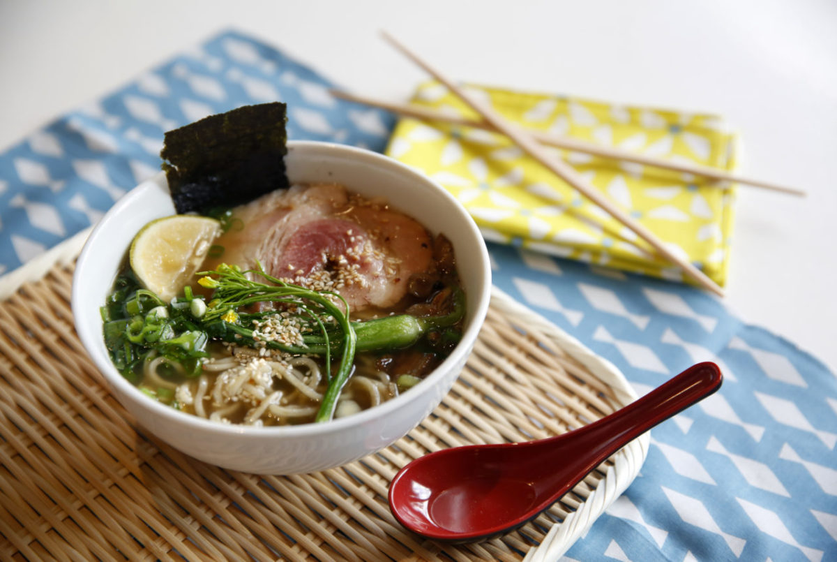 A bowl of homemade ramen soup topped with sliced pork belly, bok choy, maitake mushrooms, scallions, chives, nori (dried seaweed), an yuzu wedge, and sesame seeds, at a ramen workshop at SHED in Healdsburg, on Sunday, October 30, 2016. (BETH SCHLANKER/ The Press Democrat)