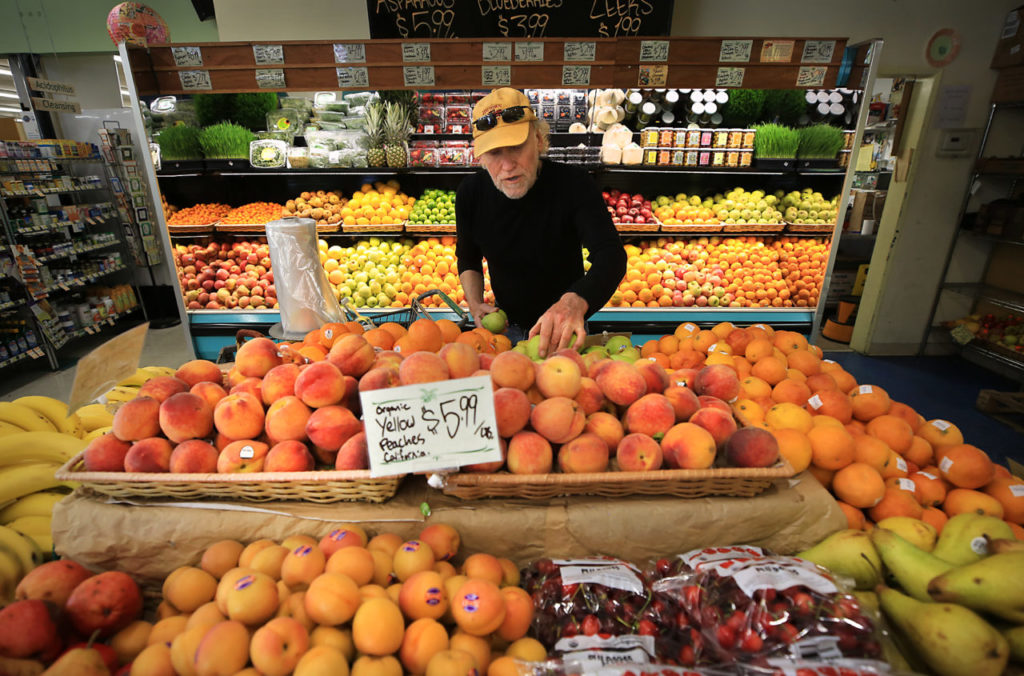 Rand Lind shops for organic produce, Tuesday May 17, 2017 at Community Market Natural Foods in Santa Rosa. Lind has been shopping at the store since 1975. (Kent Porter / The Press Democrat) 2016