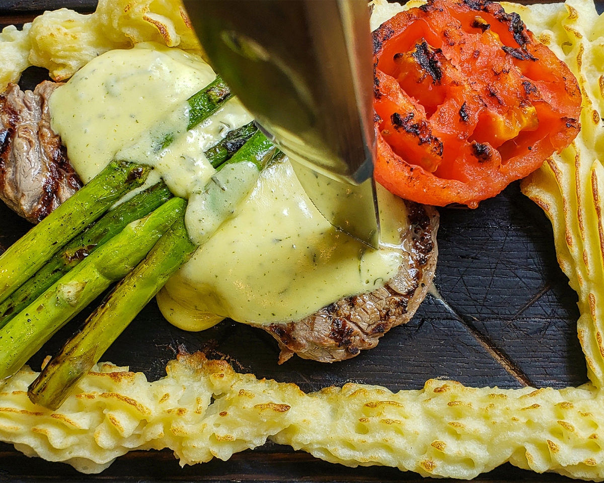 Plank steak with duchess potatoes, tomato, asparagus and Bearnaise sauce at Stockhome Restaurant in Petaluma. heather irwin/PD