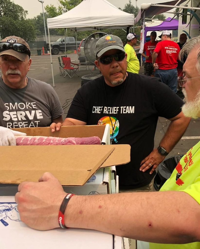 Jason, center, with Operation BBQ volunteers