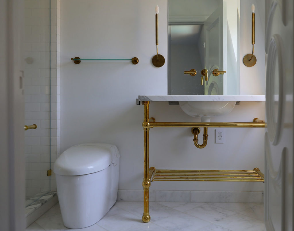 Brass fixtures adorn the bathroom in a guestroom of The Francis House, in Calistoga. (Christopher Chung/ The Press Democrat)
