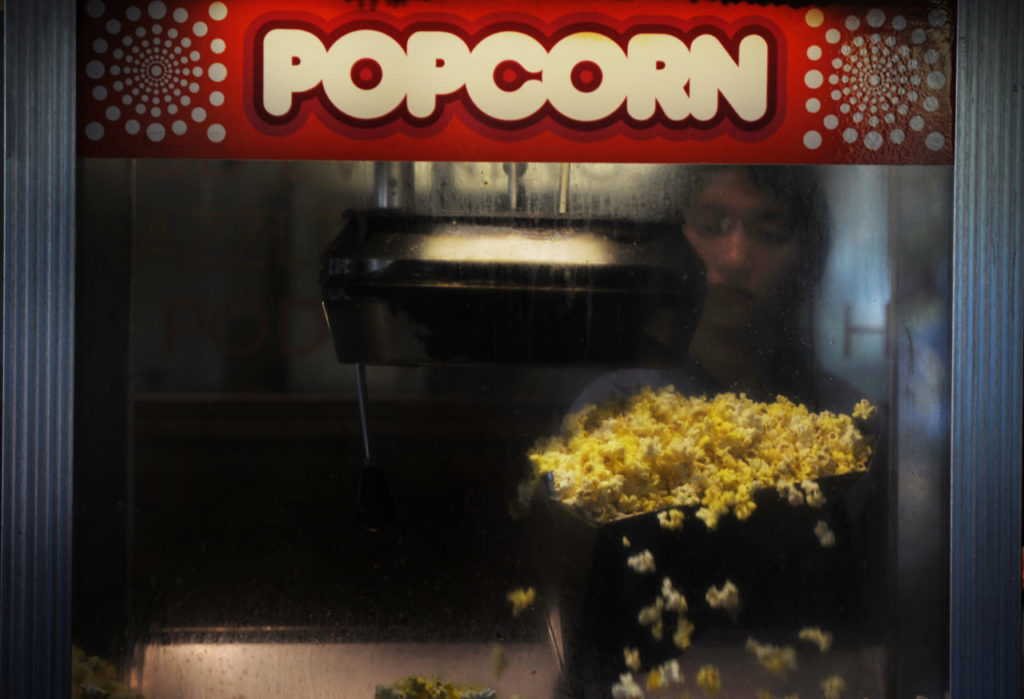Andrea Carrillo working the popcorn machine at Rialto Cinemas in Sebastopol. April 17, 2013 (Photo: Erik Castro/for The Press Democrat)