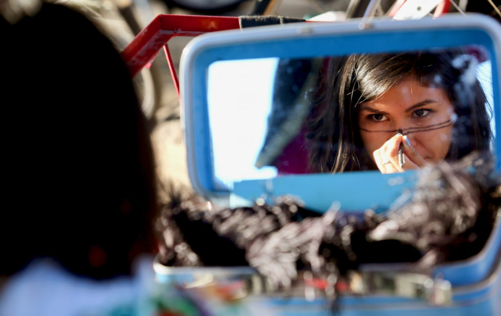 Patty Gomez of The Imaginists gets ready before the performance of The Butterfly's Evil Spell/ El Malefic de la Mariposa, a play by Federico Garcia Lorca at Martin Luther King, Jr. Park in Santa Rosa, Friday, July 24, 2015. (Crista Jeremiason / The Press Democrat)