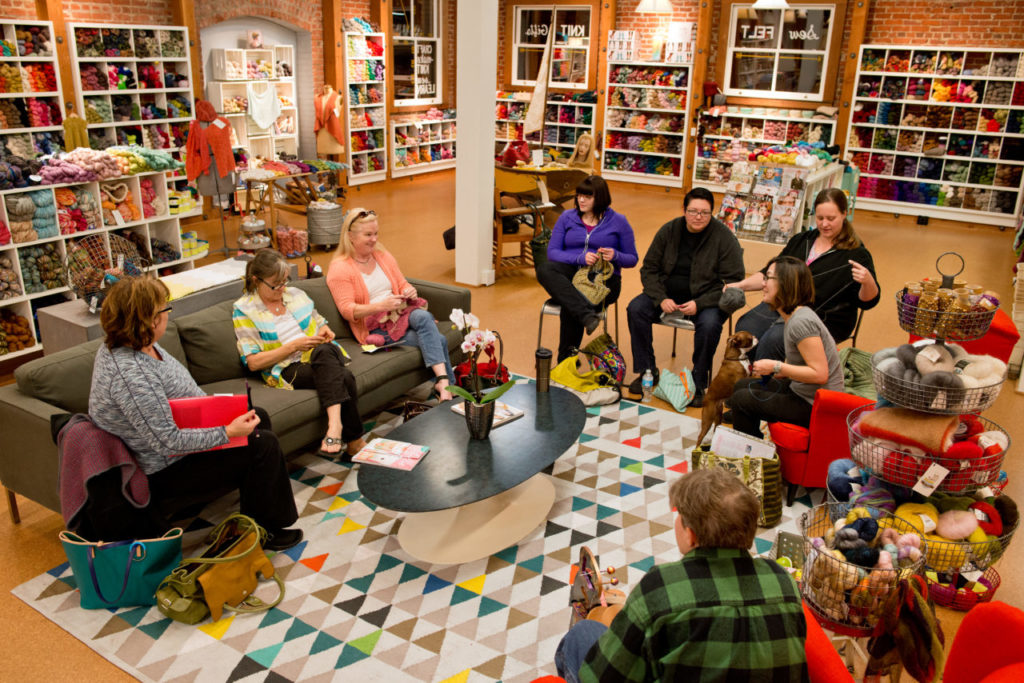 A group of customers gather for a Sit-and-stitch session, where they can bring their stitching or knitting projects and socialize at Cast Away Folk in Santa Rosa, Calif., on January 16, 2014. (Alvin Jornada / The Press Democrat)