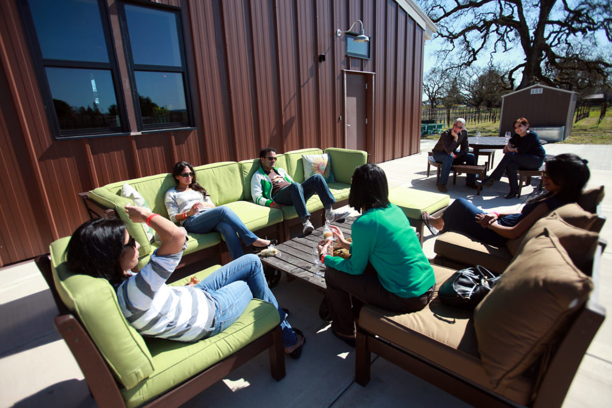 Wine tasters relax outside the new barn at Inman Family Wines, LLC during the 34th annual Barrel Tasting, March 3, 2012.