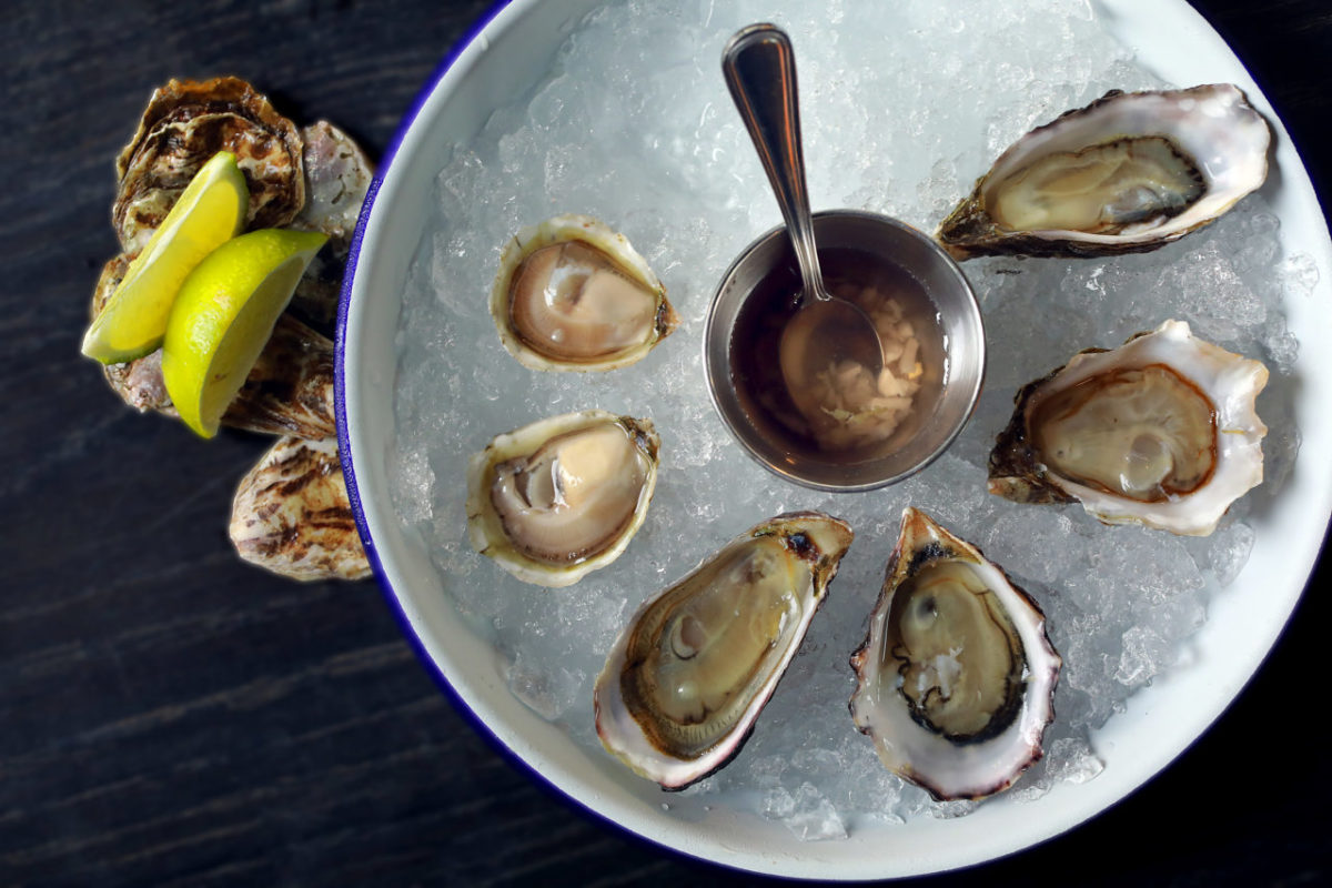 Counter-clockwise from left, the selection of daily oysters include Totten Inlet Olympias, Washington Chelsea Gem, and Hog Island Sweetwater from Handline in Sebastopol. (John Burgess/The Press Democrat)