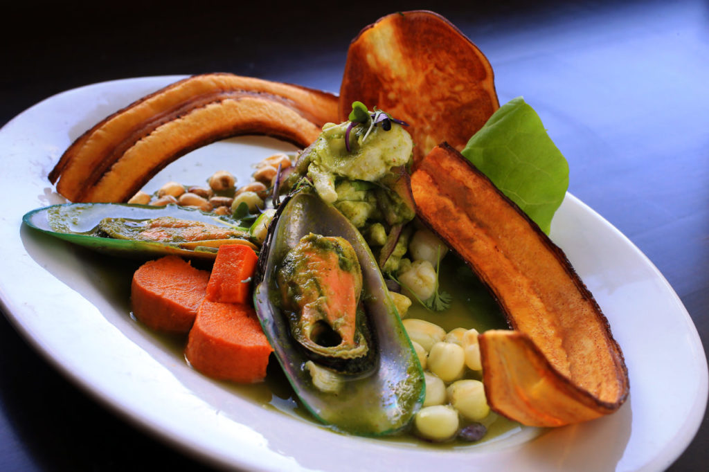 Ceviche Verde with tilapia, scallops, green lip mussels in a cilantro, parsley, Huacatay (black mint sauce), Asian celery, ginger, garlic and lime juice sauce topped with ricoto pepper and served with toasted cancha, Cuzco corn, sweet potato and plantain chips from chef/owner Jose Navarro of Sazon Peruvian Cuisine in Santa Rosa. (photo by John Burgess/The Press Democrat)