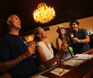 Visitors enjoy a glass of champagne at Korbel Winery in Guerneville, the oldest continually operating sparkling wine house in North America, established in 1882. That history gives Korbel the legal right to use the term “California Champagne” on its labels, even though the wines are not from Champagne, France. (John Burgess/The Press Democrat)