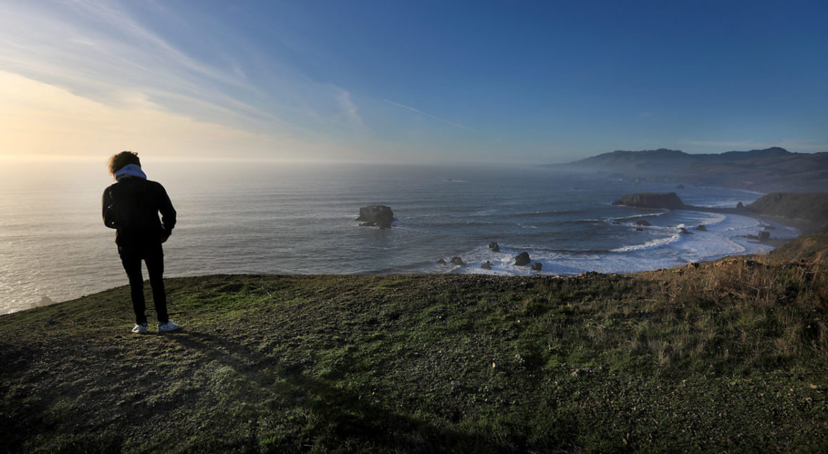 Sonoma State University student Max Dumstorff of San Diego, gets in a hike after the fog dissipates along the Sonoma County Coastline near Goat Rock State Beach, Friday Jan. 1, 2018. A pristine view as far as the eye can see, the Trump administration has renewed the prospect of offshore oil drilling along the Pacific coast and the reduction of marine sanctuaries. (Kent Porter / The Press Democrat) 2018