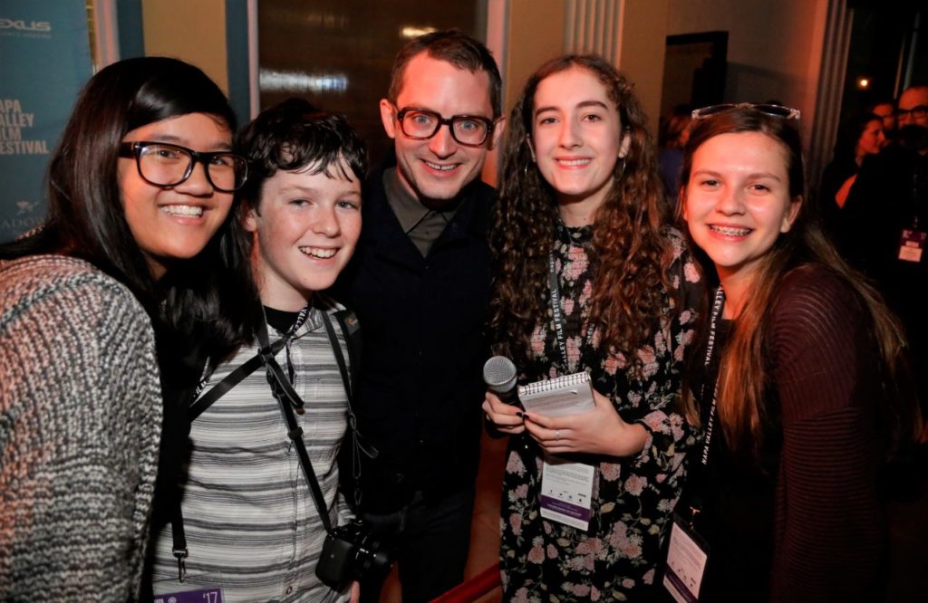 Actor Elijah Wood on the red carpet poses with teen reporters from Harvest Middle school Emily Wall, Ida Killebrelo, Amelia Leeman and Jed Rubin. The 7th Annual Napa Valley Film Festival featured spectacular film, food and wine at wineries through out the valley, red carpet appearances by Hollywood A-lister's Will Ferrell, Elijah Woods and Director Nancy Meyers and many others November 8th-12th, 2017. (Photos Will Bucquoy).