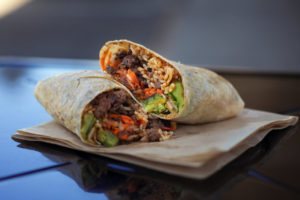 Korean Burrito with Marin sun Farms ground beef marinated with soy, brown sugar, garlic and ginger, Korean BBQ sauce, avocado, mint cilantro, pickled daikon and carrot, organic brown rice, and kimchi at Zoftig in Santa Rosa. (Chris Hardy/For Sonoma Magazine)