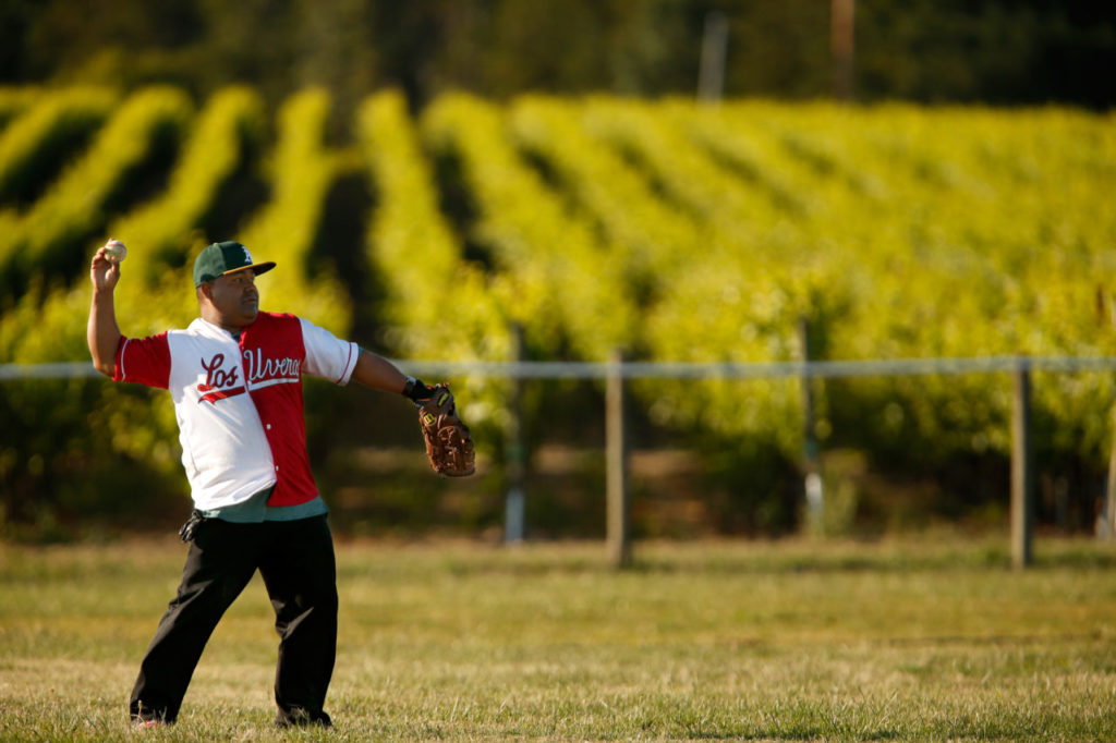Noe Nunez, wearing his Los Uveros team jersey, throws from the outfield during an informal baseball practice at Balletto Vineyard's Field of Dreams, in Santa Rosa, California on Thursday, June 9, 2016. (Alvin Jornada / The Press Democrat)