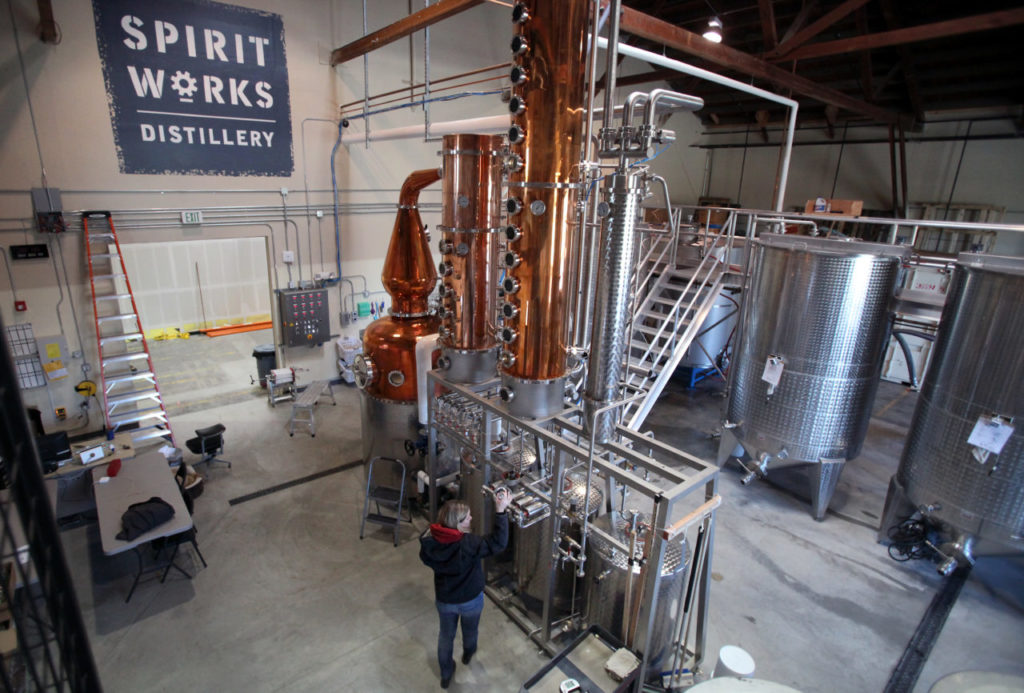 Ashby Marshall works with the hybrid pot still at Spirit Works, in The Barlow, in Sebastopol on Tuesday, January 29, 2013. (Christopher Chung/ The Press Democrat)