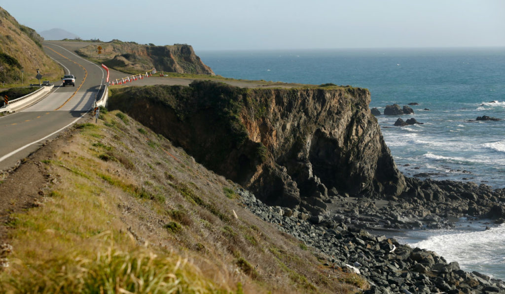 A truck drives by the pullout where the SUV of Jennifer Jean Hart and Sarah Margaret Hart was recovered off Highway 1 near Westport, California, on Wednesday, March 28, 2018. The bodies of the two women and three of their adopted children were recovered after the vehicle plunged over the cliff two days earlier, while three more of their children, Devonte Hart, 15, Hannah Hart, 16, and Sierra Hart, 12, are still missing. (Alvin Jornada / The Press Democrat)