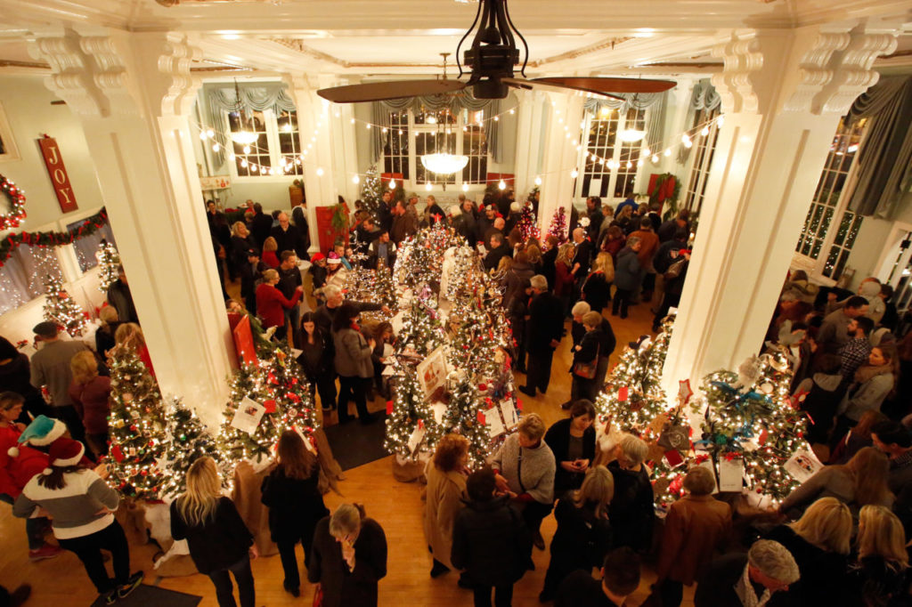 A roomful of guests look at all the Christmas trees, decorated by local businesses, that are being auctioned for charityduring the Fabulous Women of Sonoma County's Festival of Trees at Hotel Petaluma in Petaluma, California on Friday, December 1, 2017. (Alvin Jornada / The Press Democrat)