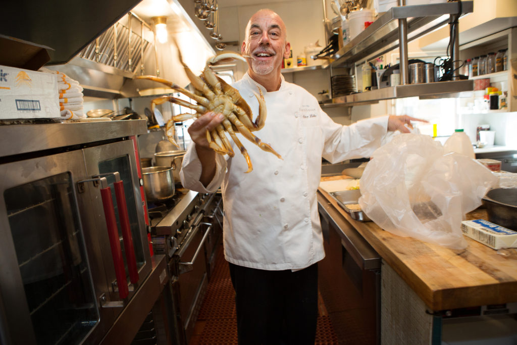 Farmhouse Inn chef Steve Litke shows off a Dungeness crab at his Michelin star-ranked restaurant. Farmhouse is now ranked by Travel and Leisure Magazine as the fourth best inn in America, and is number 28 on its WorldÕs Best Hotels list. Shot on Friday, February 20, 2015 at Farmhouse Inn in Forestville, Calif. (Photo by Charlie Gesell for the Sonoma magazine)