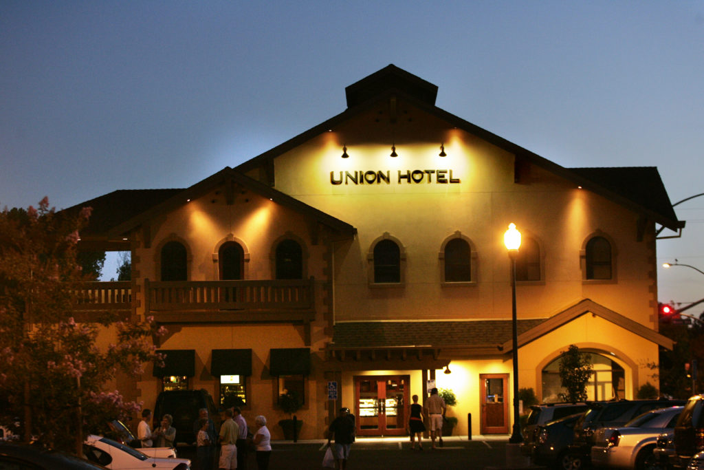 The Union Hotel on Mission Boulevard in Santa Rosa glows in a Saturday twilight. Shot on Saturday, Aug. 18, 2007, for Sonoma magazine. (Charlie Gesell / The Press Democrat)