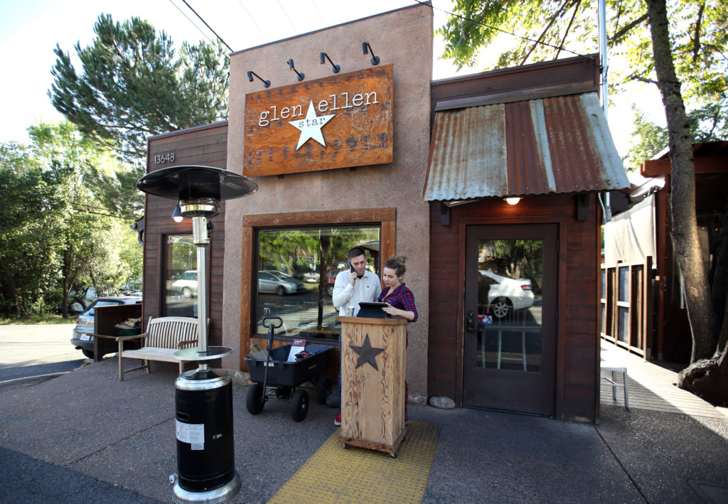 Lindsay Huntsman, right, and Sean Forney go over reservations at the Glen Ellen Star in Glen Ellen, Thursday, April 9, 2015. (CRISTA JEREMIASON / The Press Democrat)
