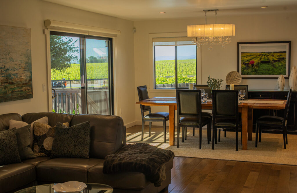 The dining room and living room at the Pinot Cottage at Benovia Winery in Santa Rosa. (Chad Surmick)