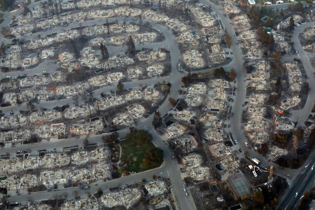 An aerial view of the destruction caused by the Tubbs fire in the Larkfield/Wikiup area. (photo by John Burgess with Helico/The Press Democrat)