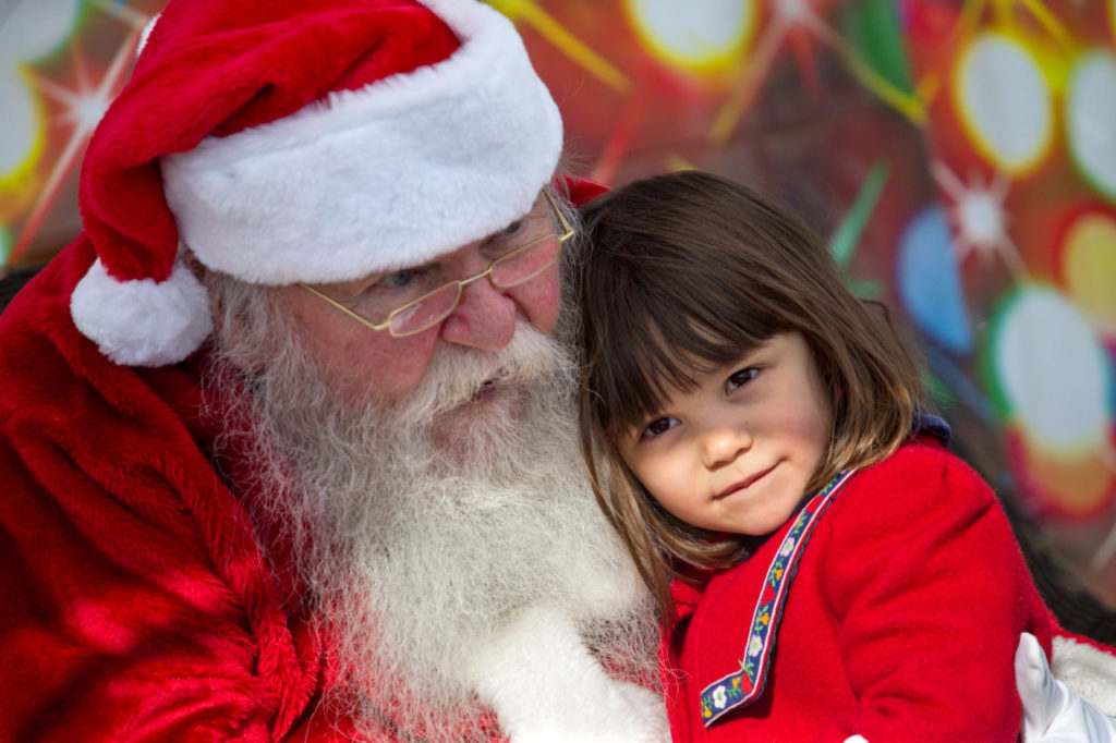 Santa listened to hundreds of Christmas lists at the Pacific Coast Air Museum on Saturday. (photo by John Burgess/The Press Democrat)