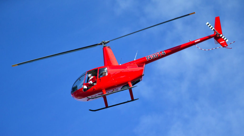 Santa and Mrs. Claus flew into the Pacific Coast Air Museum on Saturday in a helicopter. (photo by John Burgess/The Press Democrat)