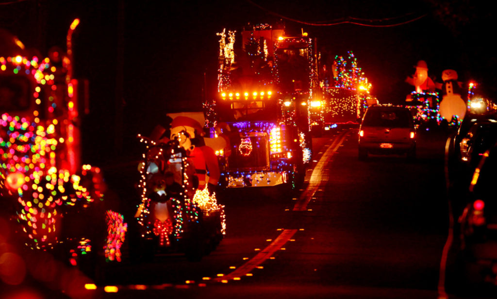 11/25/2013: B1: PC: Geyserville's lighted tractor parade rolls down Geyserville Avenue Saturday Nov. 24, 2012 . The parade included some farm equipment, fire trucks and tractor trailer rigs. (Kent Porter / Press Democrat) 2012