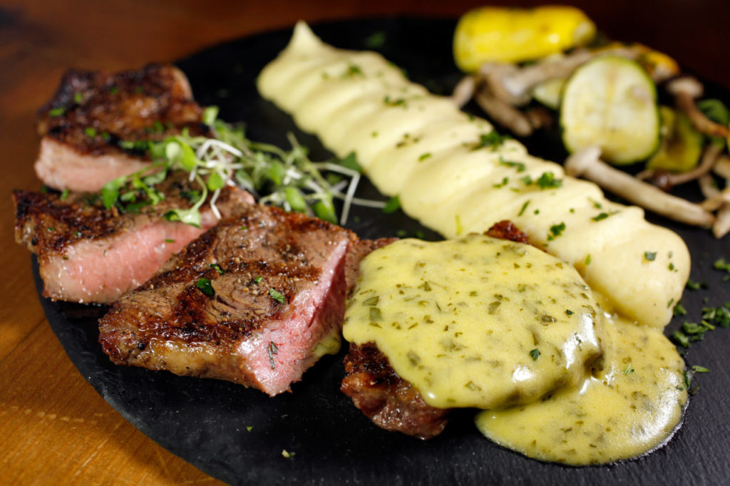 New York strip with bearnaise sauce, pomme puree, and summer squash with wild mushrooms at Litchfield's restaurant at Sonoma Coast Villa Resort and Spa in Bodega, California, on Thursday, August 30, 2018. (Alvin Jornada / The Press Democrat)