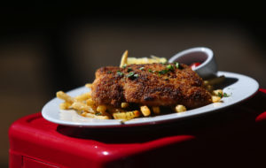 Schnitzel served on a bed of fries at Franchetti's for Oktoberfest. (Christopher Chung/ The Press Democrat)