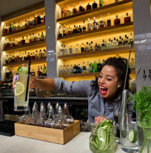 Sonoma Magazine-Eat Here Now. The laughing bartender Bri Hall serves up cocktails at the Perch and Plow on Courthouse Square in Santa Rosa. (photo by John Burgess/The Press Democrat)